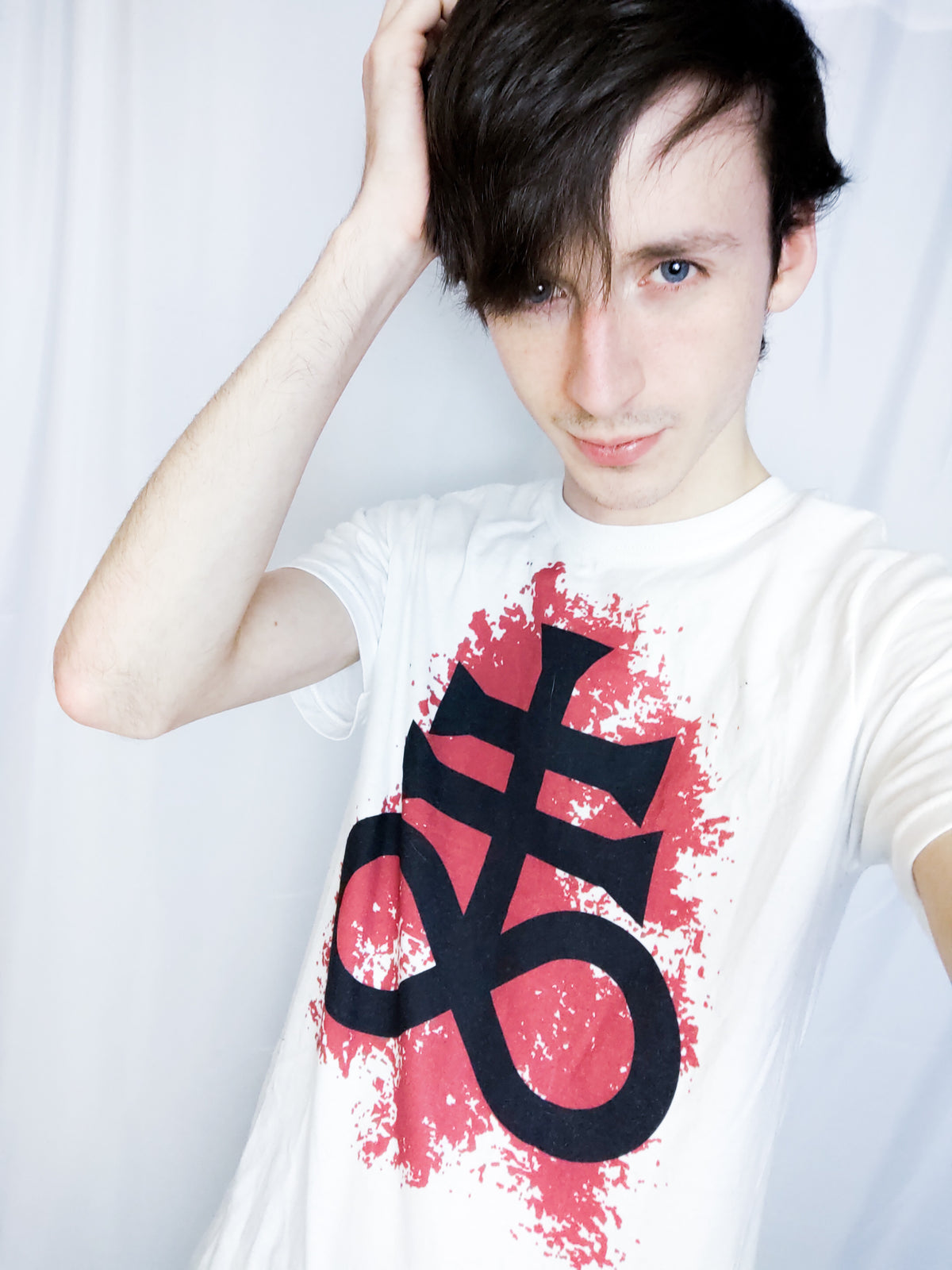 Joshua Roe modeling one of  Luvicks T-shirts. the Leviathan Cross T-shirt